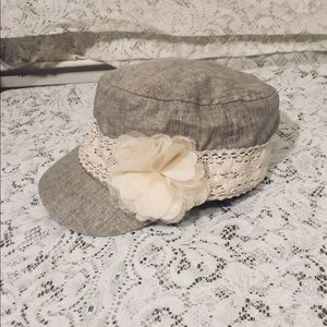 Cute tan hat with crochet band and flower detail